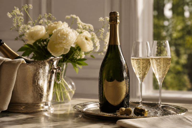https://www.californiachampagnesabers.com/wp-content/uploads/2026/05/Elegant-Champagne-setup-with-chilled-bottle-and-sparkling-glasses-beside-white-flowers-1.png