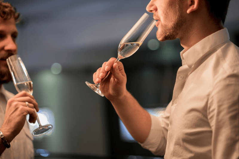 https://www.californiachampagnesabers.com/wp-content/uploads/2026/05/Two-guests-tasting-Champagne-from-flute-glasses-at-an-evening-celebration.png